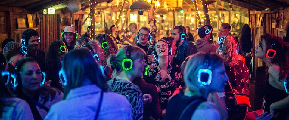 Crowd dancing at silent disco party